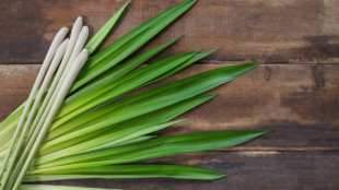 Lemongrass laying across a wooden table