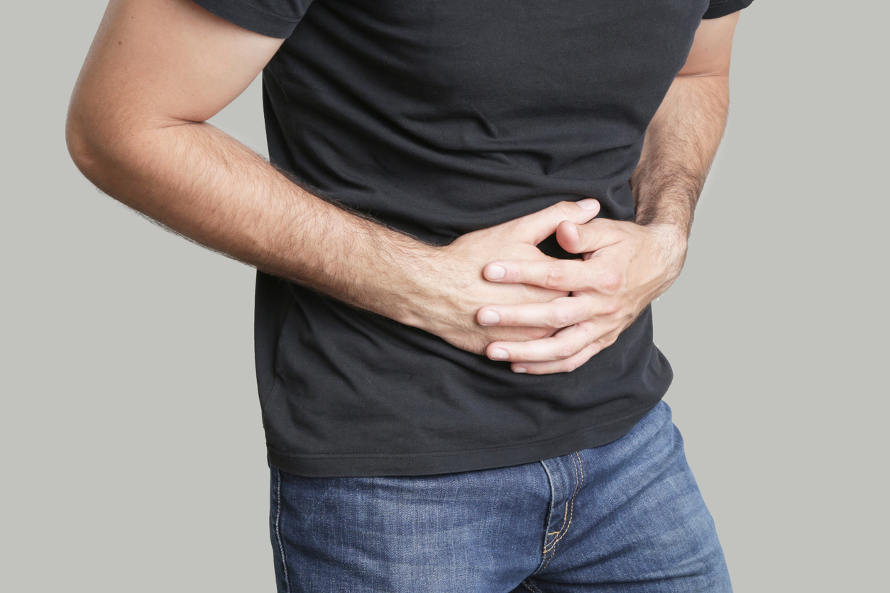Man having painful stomach ache, chronic gastritis or abdomen bloating