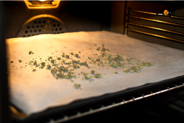 Cooking cannabis buds in oven to activate psychoactive effects
