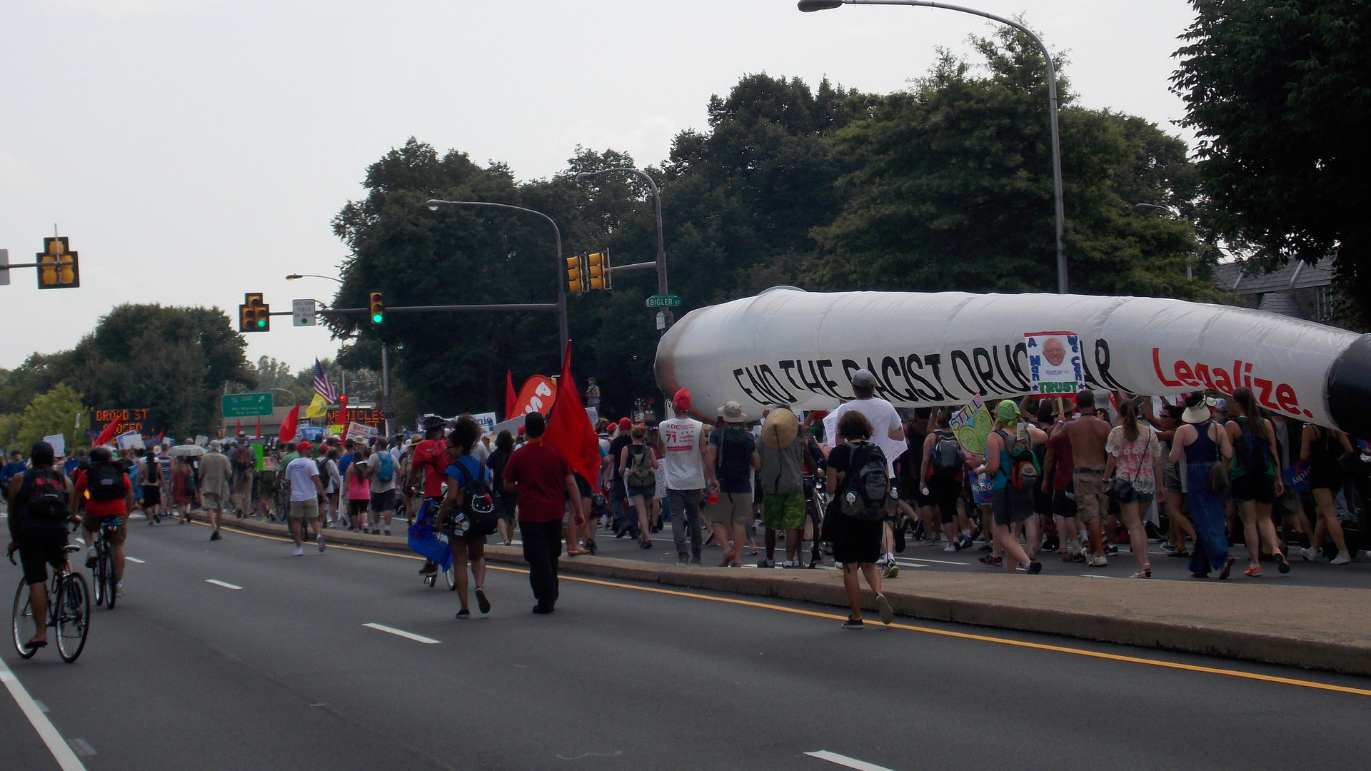 Philadelphia, PA, USA - July 25, 2016: Protesters march down Broad Street carrying an inflatable marijuana cigarette during the Democratic National Convention.