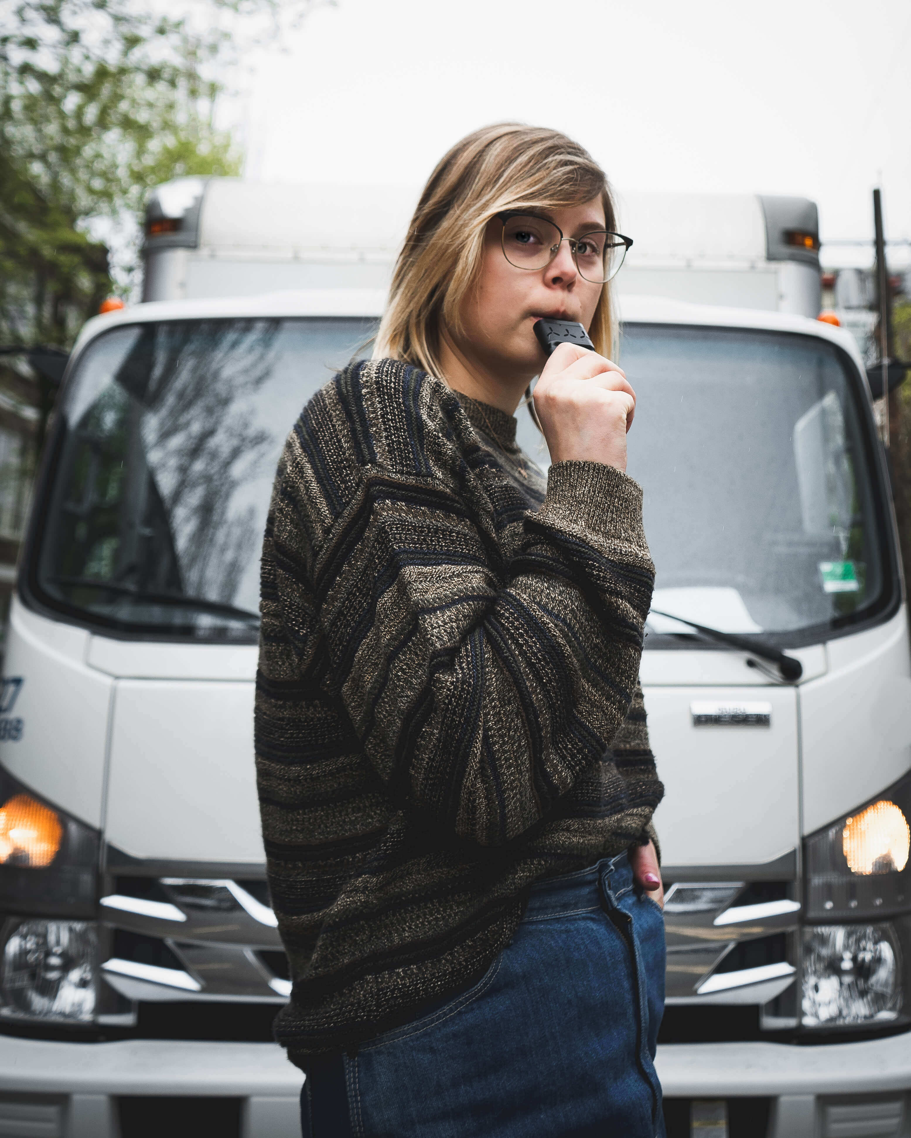vaping in front of a truck