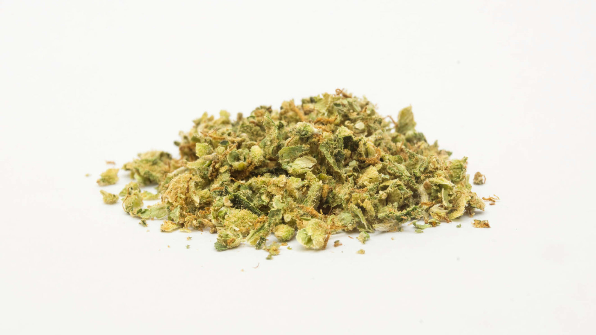 Small pile of ground marijuana on a white background