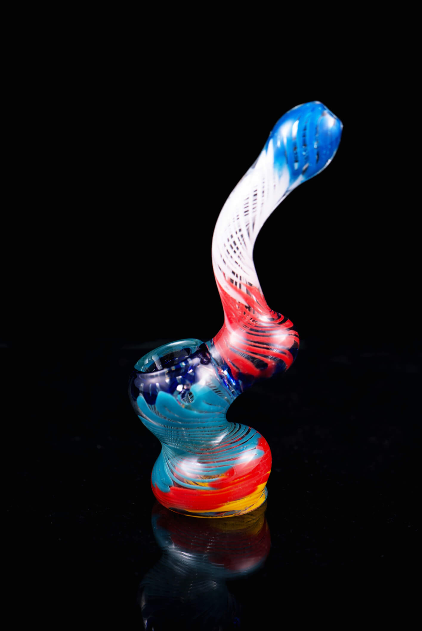 Small glass bubbler used for smoking dried cannabis isolated over black background