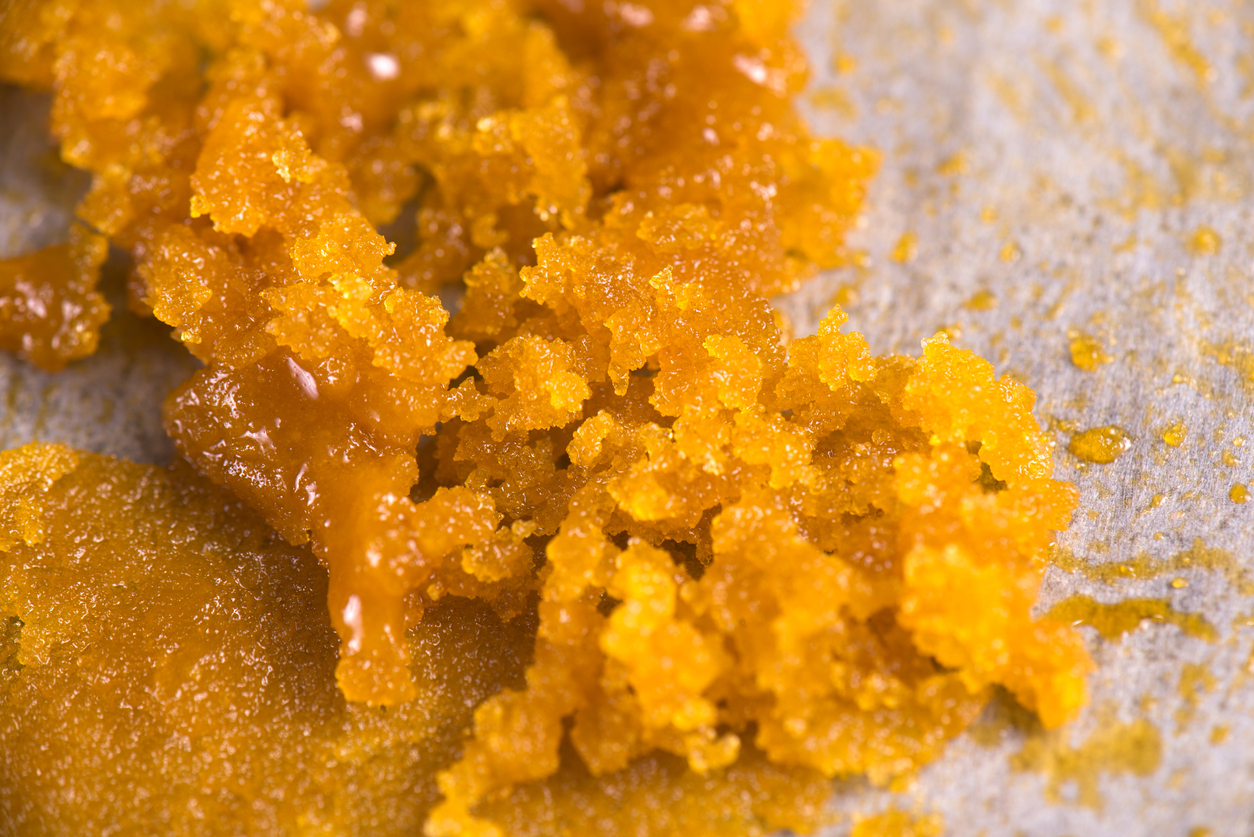 Abstract background of cannabis concentrate live resin macro detail extracted from medical marijuana