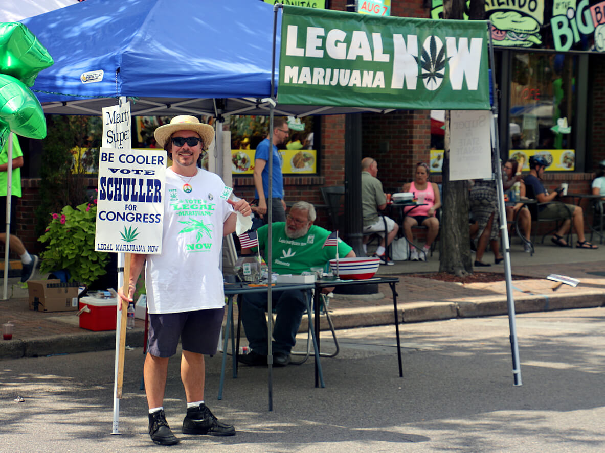 Minneapolis, Minnesota, USA - August 7, 2016: Volunteers for Dennis Schuller campaigning in Northeast Minneapolis during the Open Streets Northeast event on a platform for "Legal Marijuana Now."