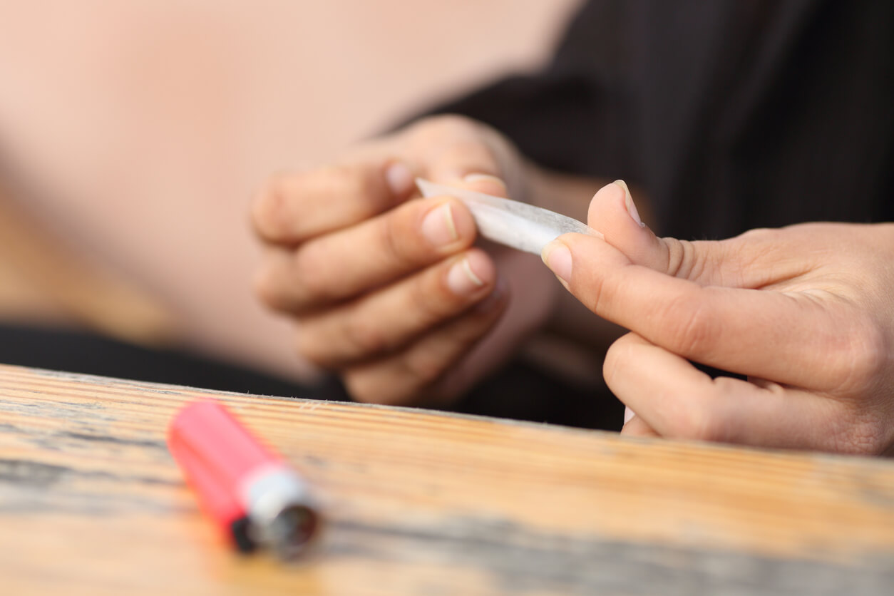 Close up of a woman hands making a cigarette