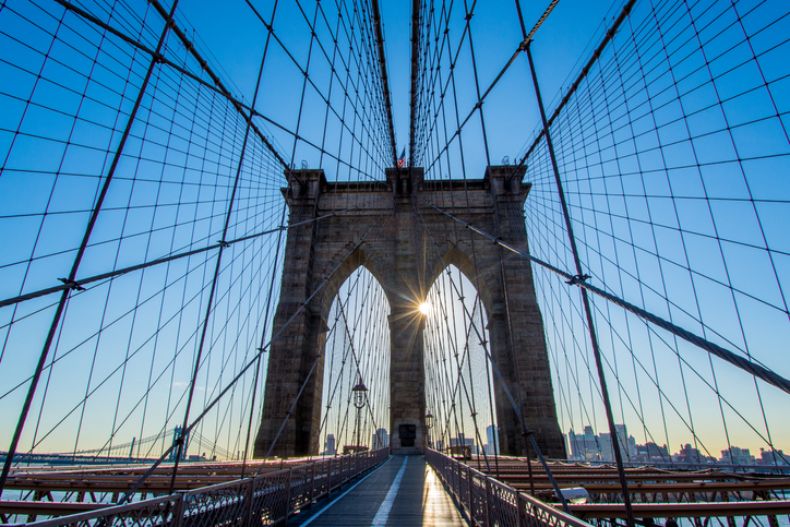The Brooklyn Bridge with sunshine peeking through.