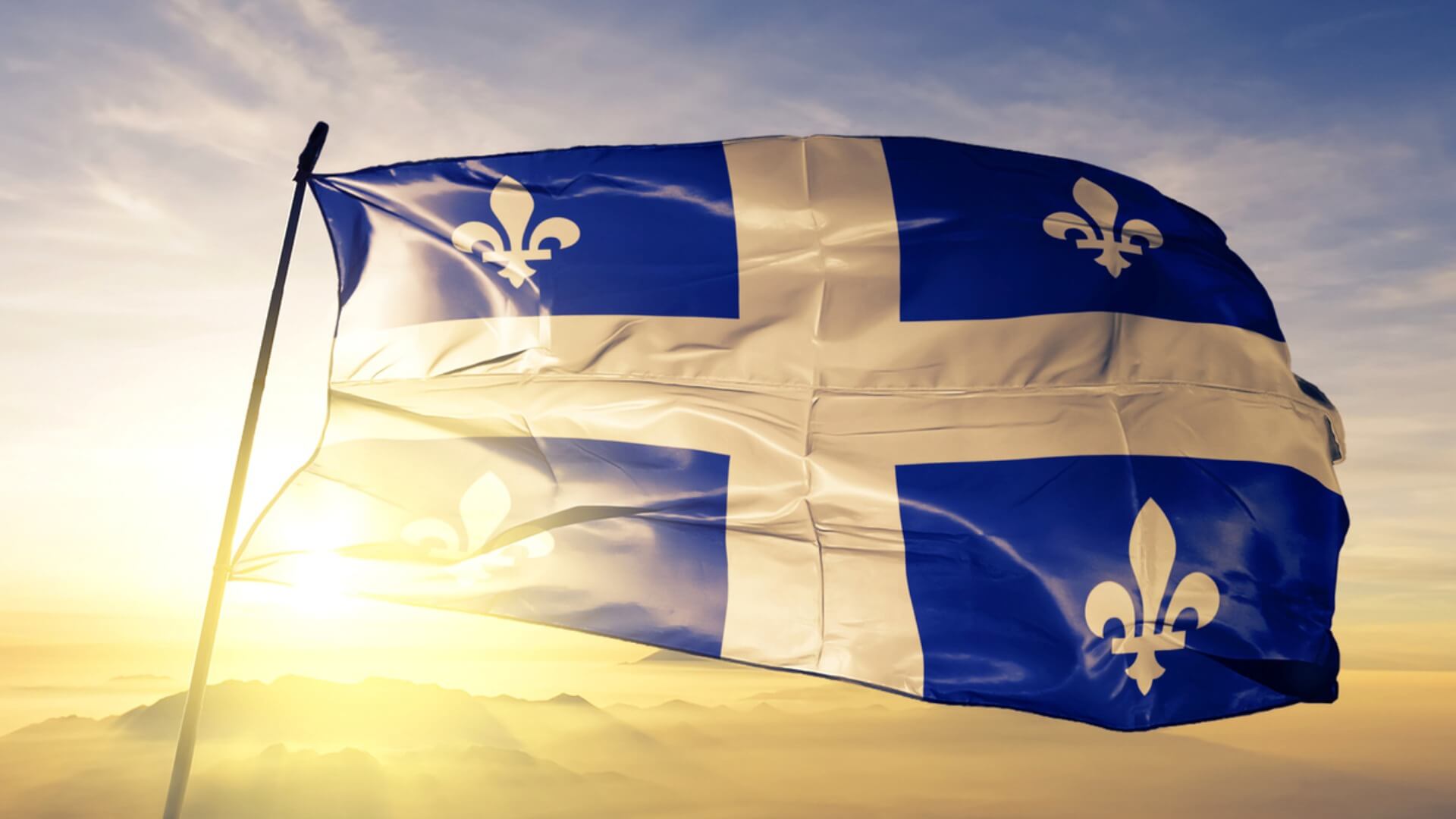 Quebec flag blowing in the wind.
