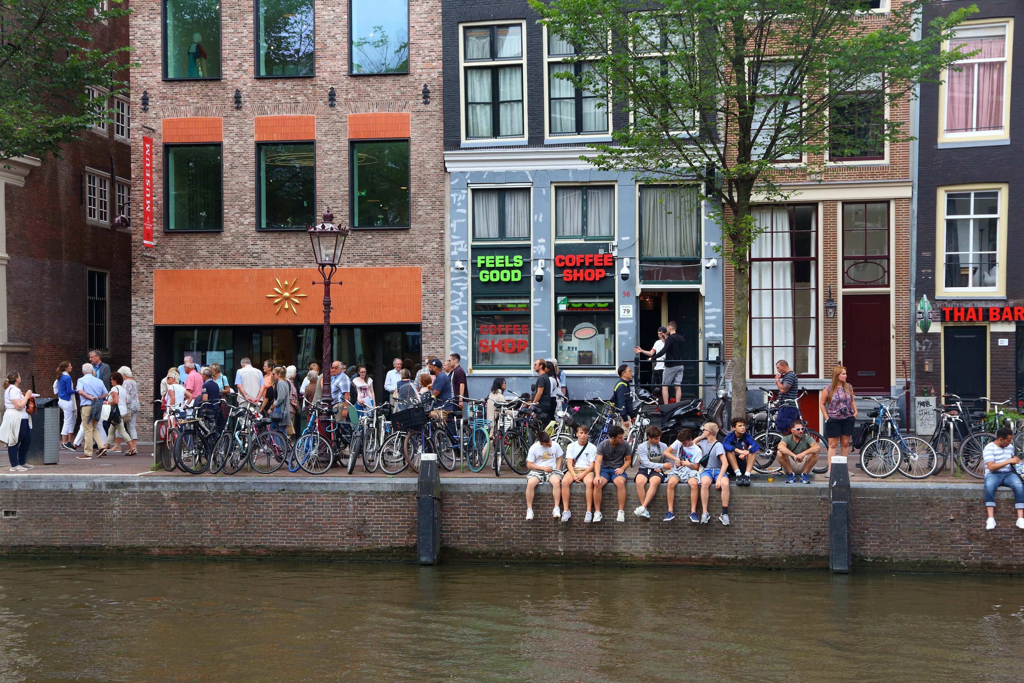 People visit a coffee shop in Amsterdam, Netherlands. Coffeeshops legally sell marijuana for personal consumption.
