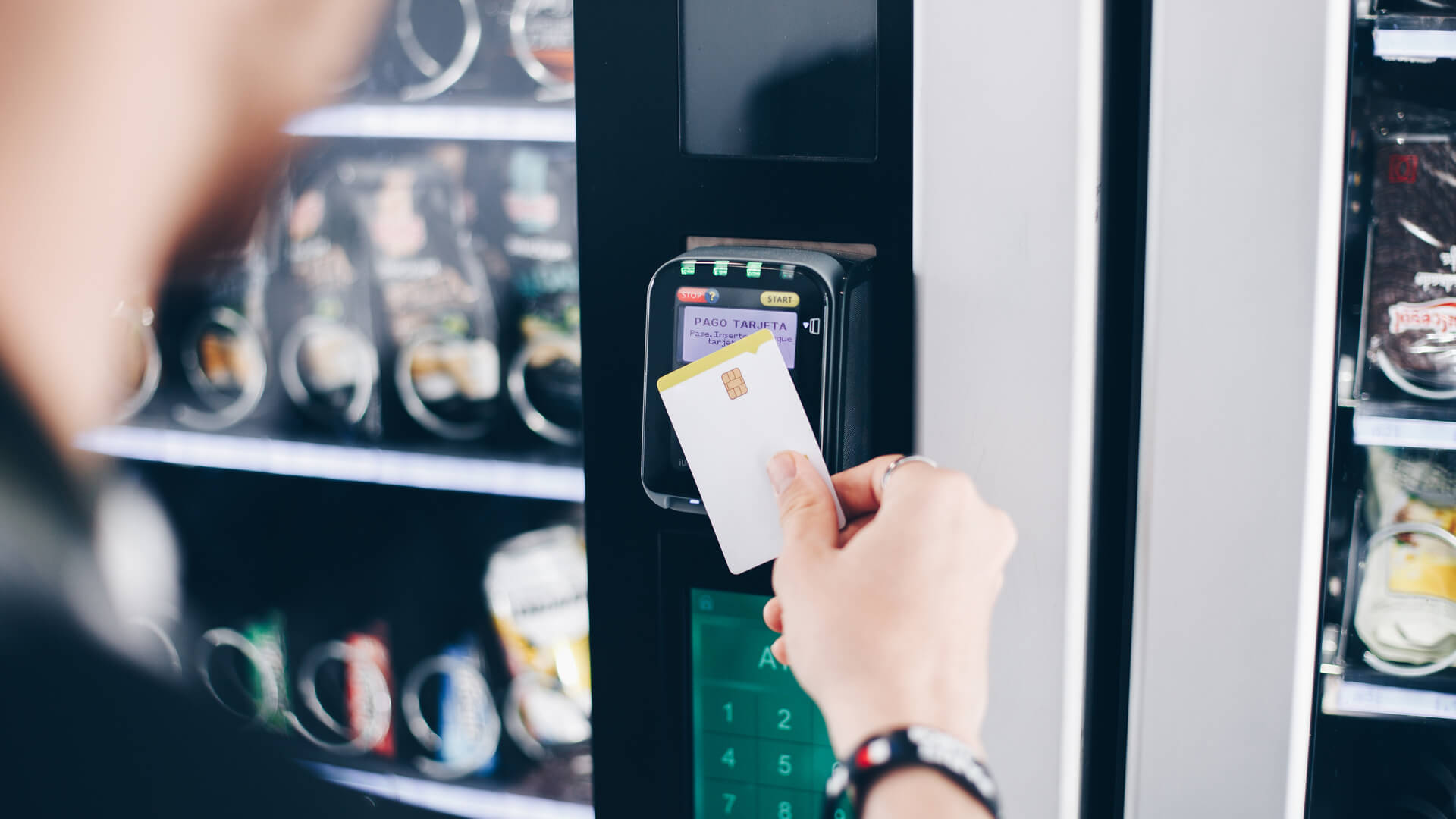 Man Using Card on Contactless Vending Machine