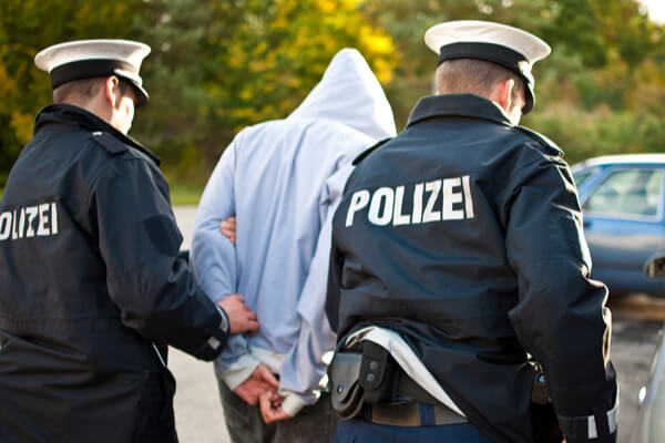 Person being arrested by German police