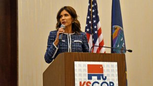 South Dakota Governor Kristi Noem addresses guests at a convention