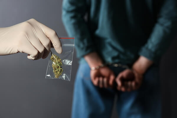 A person being arrested for cannabis possession