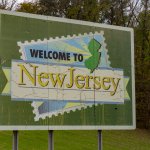 A green sign welcoming visitors to New Jersey