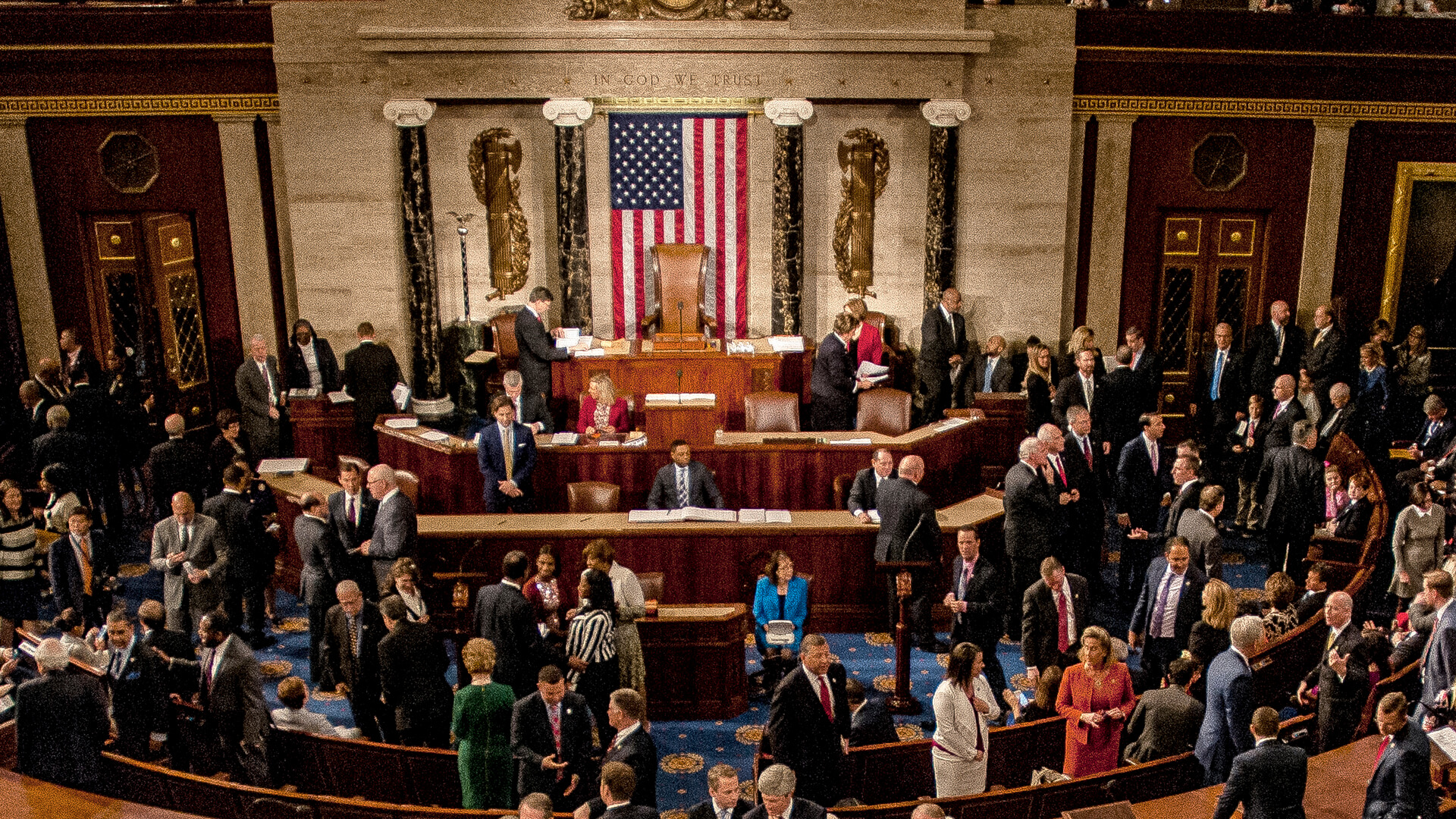 Members of Congress speaking on the house floor