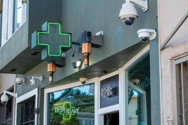The outside of a dispensary with security cameras