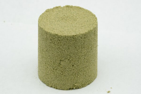 A column of light green cannabis hash kief.