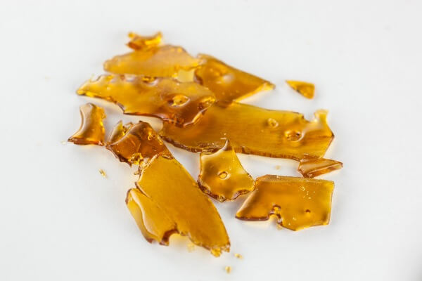 amber colored cannabis concentrate that has a glass-like look