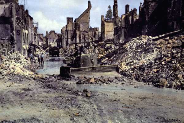 A gray rumbling French town left behind by a World War II bombing raid.