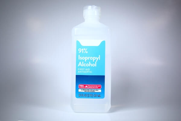 A plastic bottle of isopropyl alcohol.